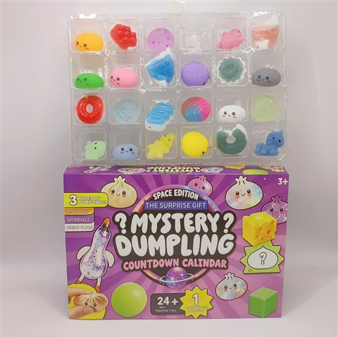 Assorted mini dumpling and baozi squishies from the countdown calendar, displaying multiple colourways and tactile interior fills including PP cotton, gold powder, and coloured beads.